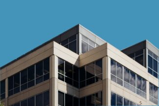 brown concrete building under blue sky during daytime