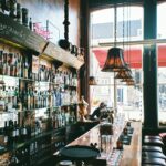 brown wooden bar table near window