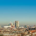 city skyline under blue sky during daytime