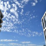 Modern buildings against a bright blue sky