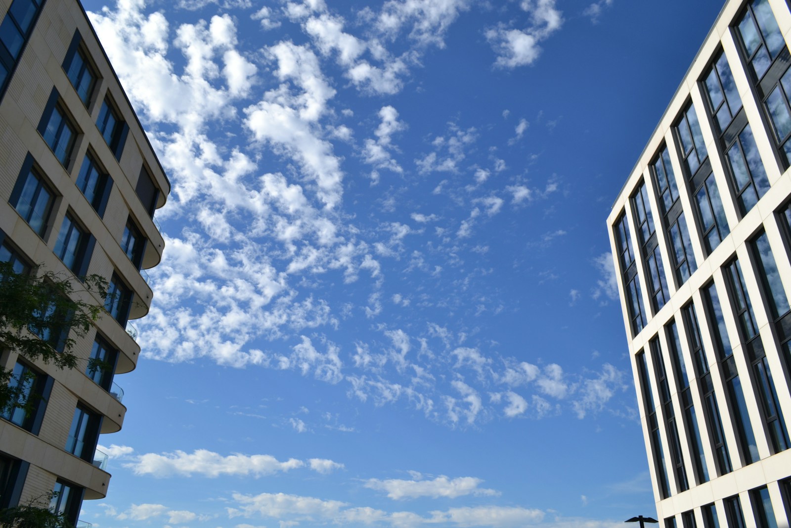 Modern buildings against a bright blue sky