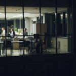 People working late in a modern office at night