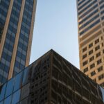 Modern glass buildings against a clear sky