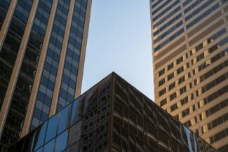 Modern glass buildings against a clear sky