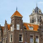 a tall brick building with a clock tower