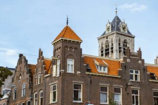 a tall brick building with a clock tower