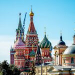 Saint Basil's Cathedral with colorful onion domes against a clear blue sky in Moscow