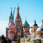 Saint Basil's Cathedral with colorful onion domes against a clear blue sky in Moscow