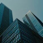 a couple of tall buildings sitting next to each other