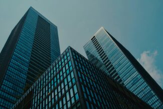 a couple of tall buildings sitting next to each other