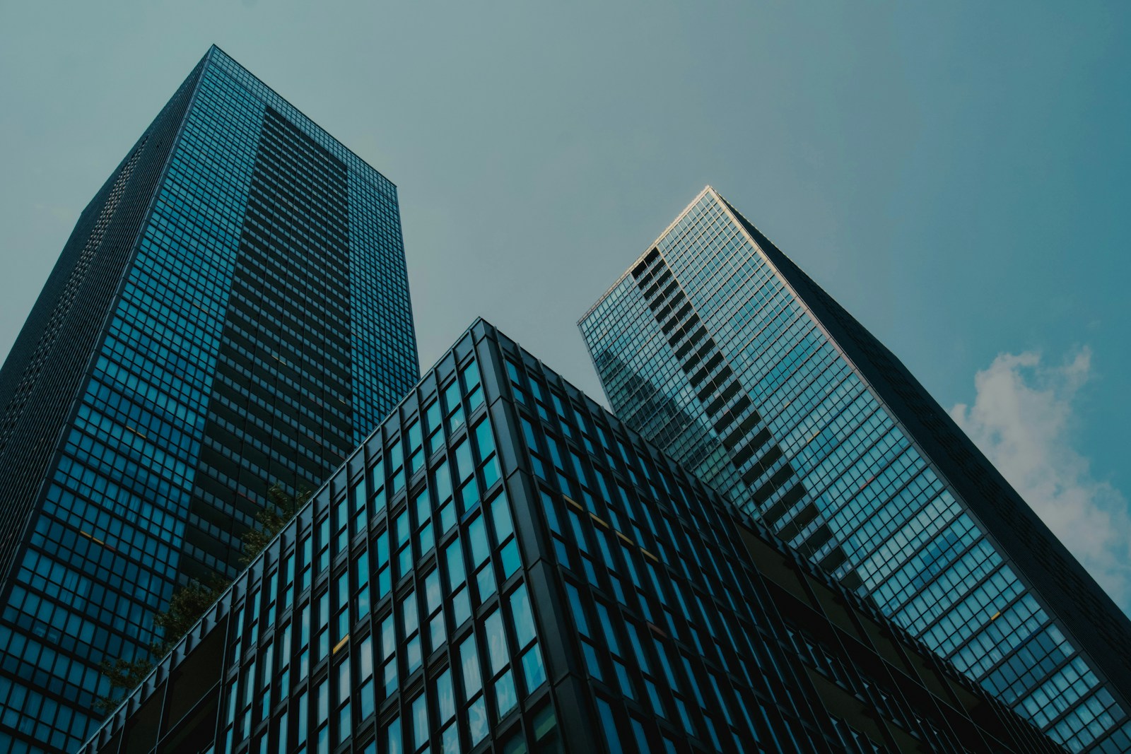 a couple of tall buildings sitting next to each other