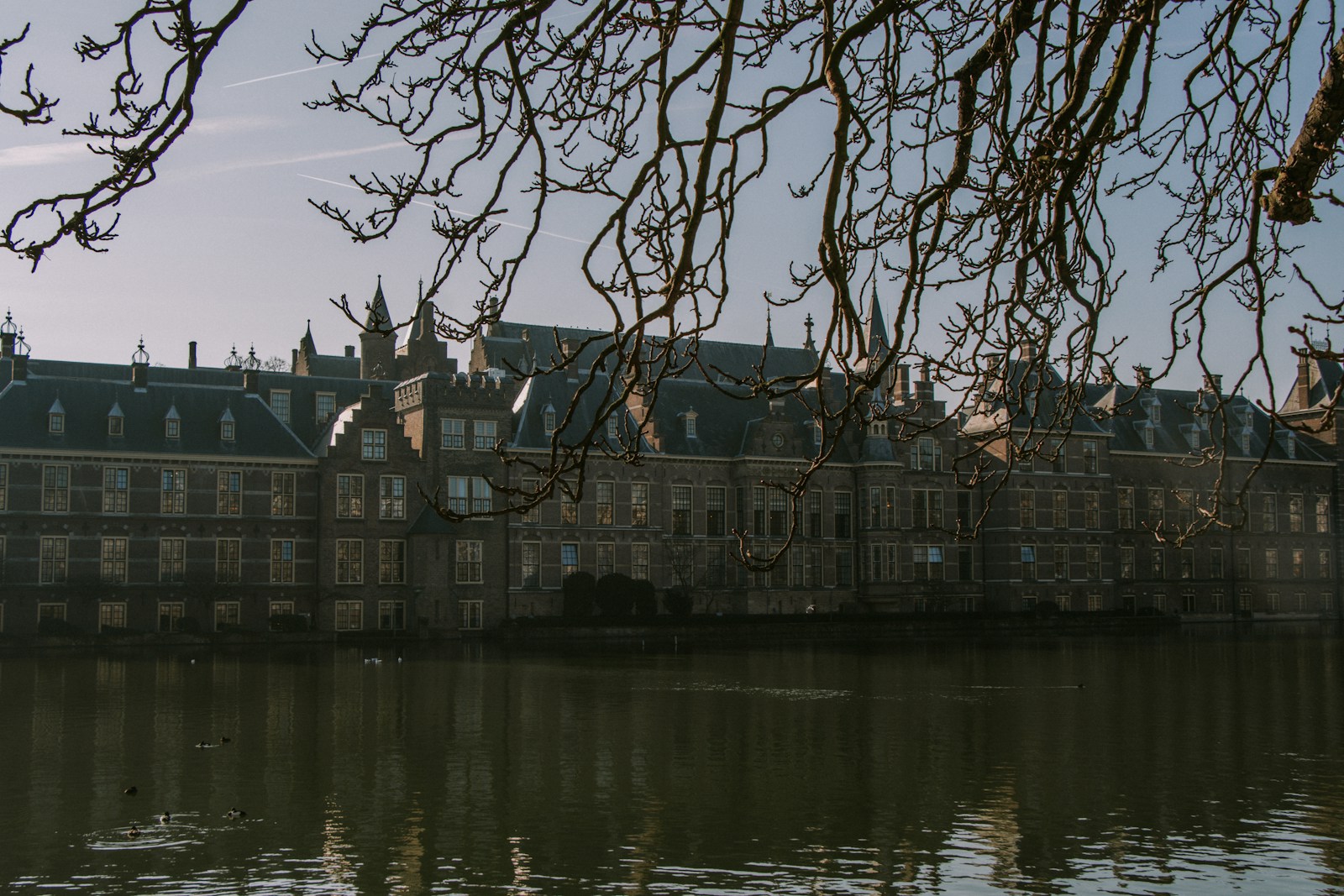a large building sitting next to a body of water
