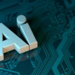 The letters AI in white 3D block font on a dark teal circuit board